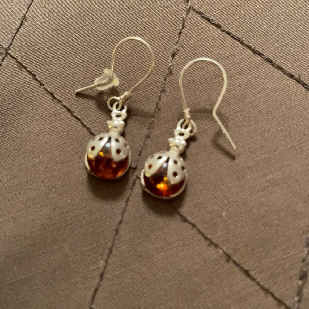 Unmarked silver and amber ladybug earrings.